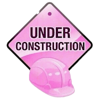 a pink construction sign with the words under construction